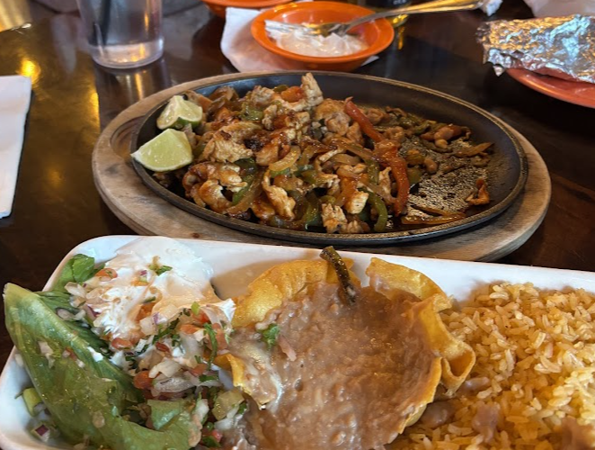 Aztecas Restaurant & Cantina signature dishes Aztecas SamplerEnchilada Dinner Chimichanga Dinner